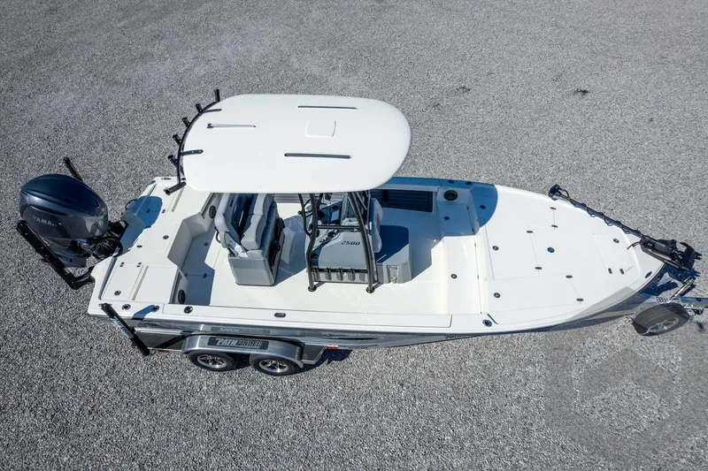 Slide: The Image of 2026 Pathfinder 2500 Hybrid boat on trailer, aerial view, white deck, Yamaha engine. - 108