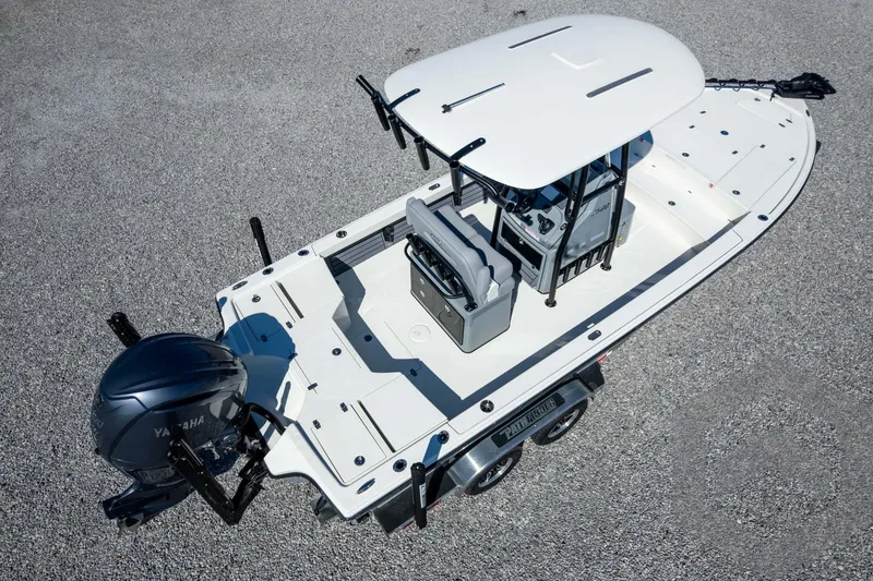 Slide: The Image of 2026 Pathfinder 2500 Hybrid boat with Yamaha engine, aerial view on gravel surface. - 109