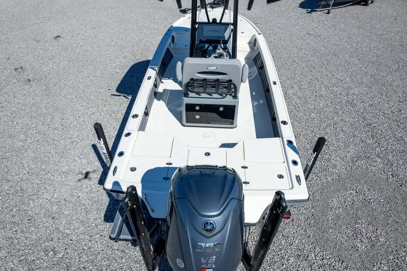 Slide: The Image of 2026 Pathfinder 2500 Hybrid boat with Yamaha engine on gravel surface. - 110
