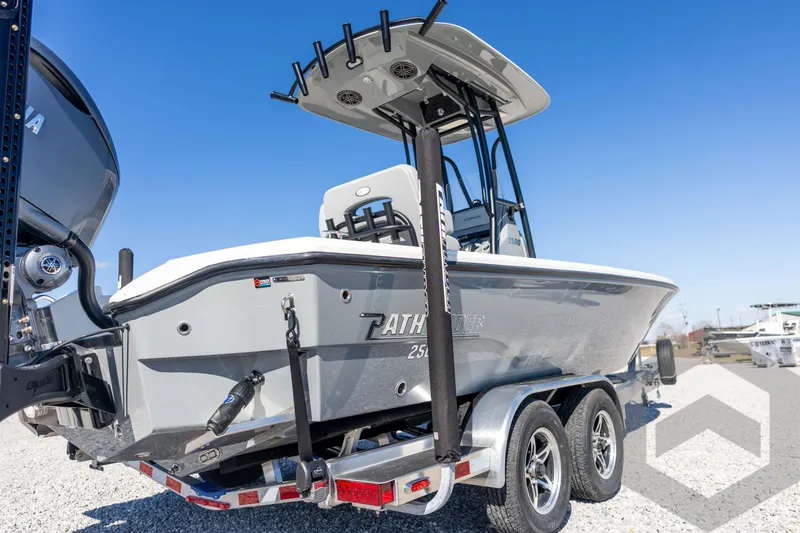Slide: The Image of 2026 Pathfinder 2500 Hybrid boat on trailer, clear sky background. - 16