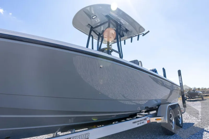 Slide: The Image of 2026 Pathfinder 2500 Hybrid boat on trailer under clear blue sky. - 38