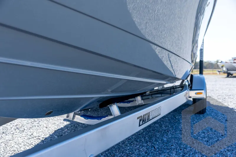 Slide: The Image of 2026 Pathfinder 2500 Hybrid boat on trailer, close-up view. - 39