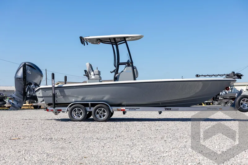 Slide: The Image of 2026 Pathfinder 2500 Hybrid boat on trailer, side view, outdoors. - 4