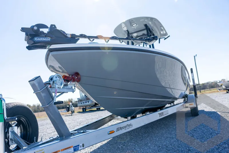 Slide: The Image of 2026 Pathfinder 2500 Hybrid boat on trailer, featuring Garmin equipment, parked outdoors. - 40