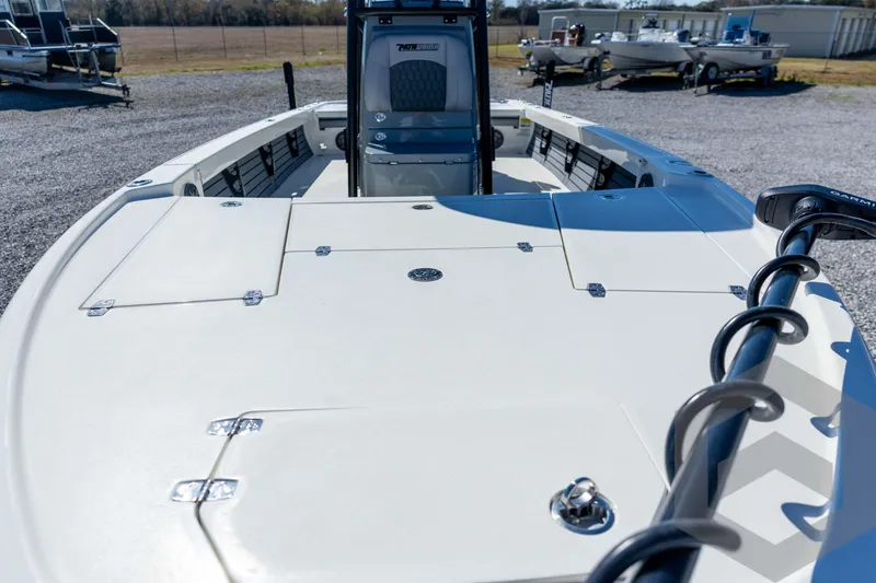 Slide: The Image of 2026 Pathfinder 2500 Hybrid boat deck with storage compartments and trolling motor. - 42