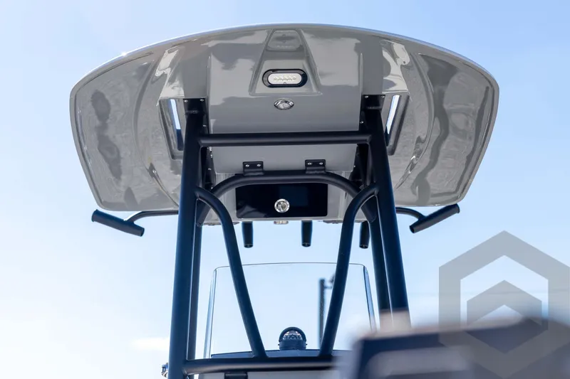 Slide: The Image of 2026 Pathfinder 2500 Hybrid boat's T-top structure against a clear blue sky. - 44