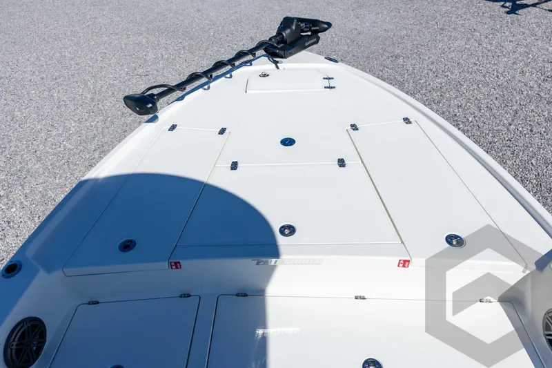 Slide: The Image of 2026 Pathfinder 2500 Hybrid boat deck with storage compartments and trolling motor. - 47