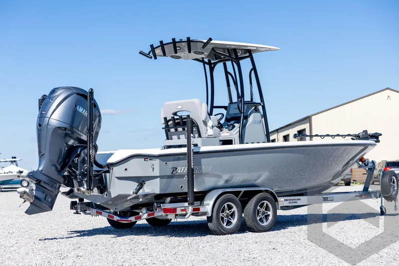 Slide: The Image of 2026 Pathfinder 2500 Hybrid boat on trailer with Yamaha outboard motor, parked outdoors. - 5