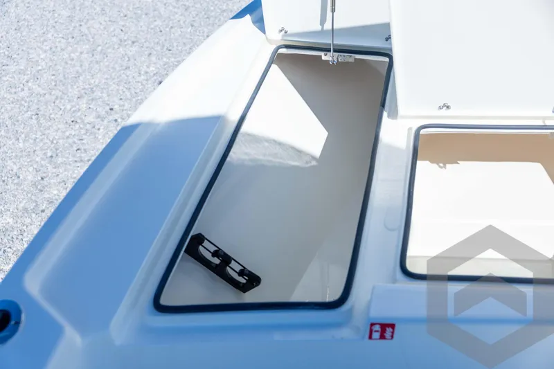 Slide: The Image of Open storage compartment on 2026 Pathfinder 2500 Hybrid boat deck. - 50