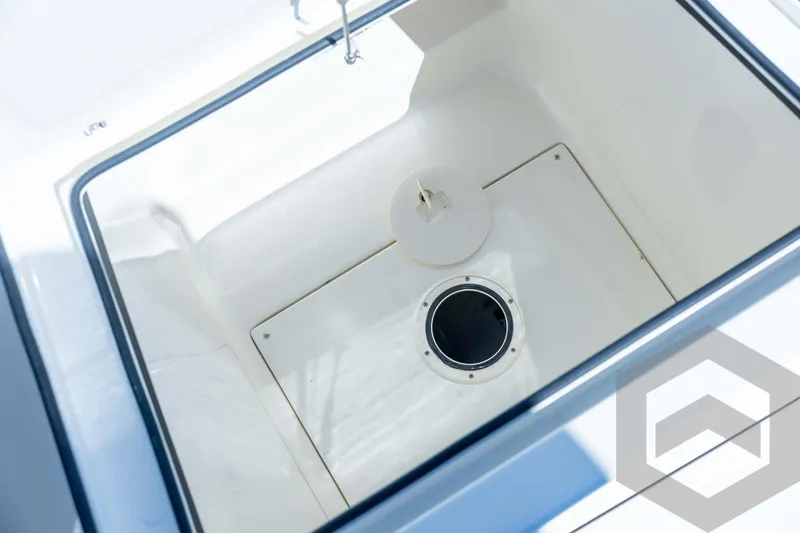 Slide: The Image of Open storage compartment in 2026 Pathfinder 2500 Hybrid boat. - 53