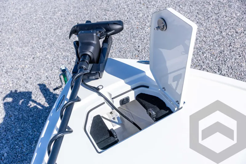 Slide: The Image of 2026 Pathfinder 2500 Hybrid boat with open storage compartment and motor detail. - 54