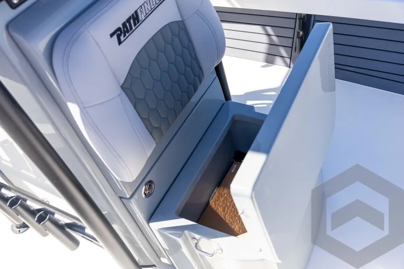 Slide: The Image of 2026 Pathfinder 2500 Hybrid boat seat with storage compartment open, showcasing modern design. - 55