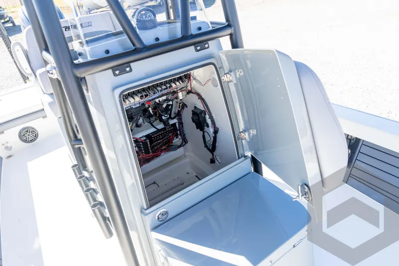 Slide: The Image of 2026 Pathfinder 2500 Hybrid boat console with open electrical compartment, showcasing wiring and components. - 56