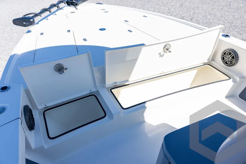 Slide: The Image of 2026 Pathfinder 2500 Hybrid boat with open storage compartments and sleek design. - 59