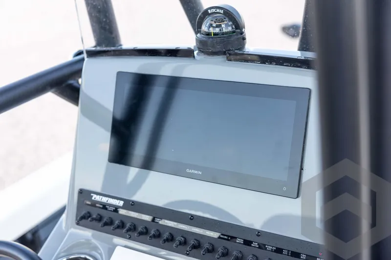 Slide: The Image of 2026 Pathfinder 2500 Hybrid dashboard with Garmin display and Ritchie compass. - 69