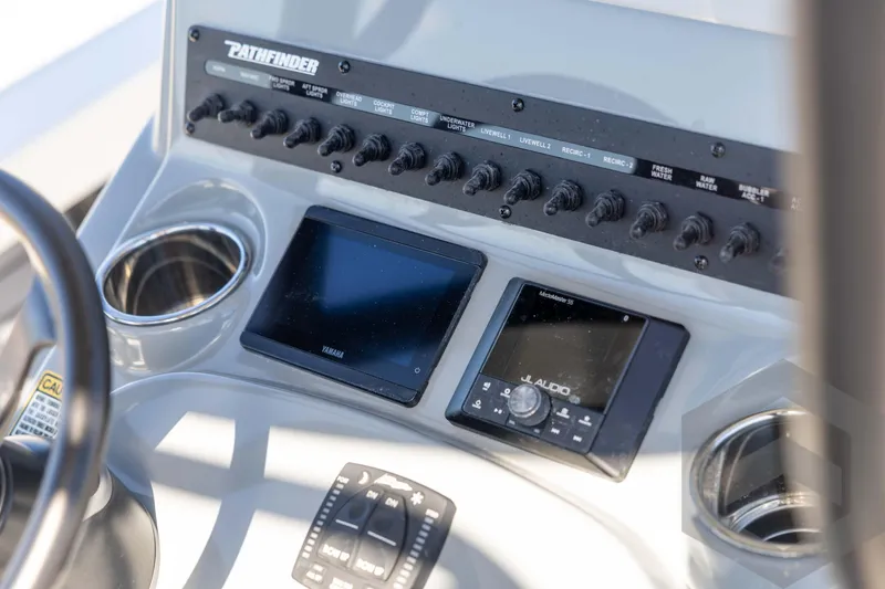 Slide: The Image of Control panel of 2026 Pathfinder 2500 Hybrid boat with Yamaha and JL Audio systems. - 70