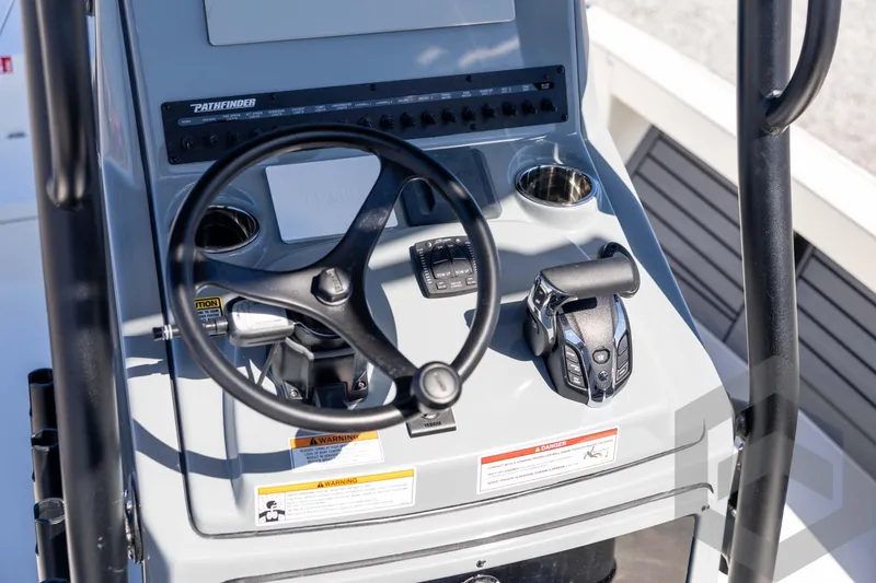 Slide: The Image of Control panel of 2026 Pathfinder 2500 Hybrid boat with steering wheel and throttle. - 71
