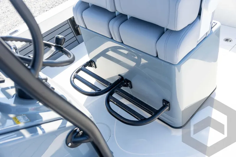 Slide: The Image of 2026 Pathfinder 2500 Hybrid boat interior with cushioned seating and footrests. - 73