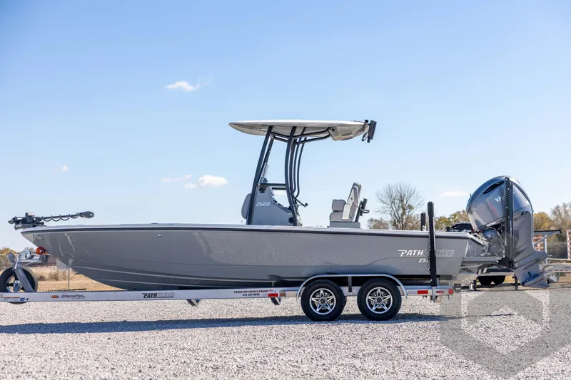 Slide: The Image of 2026 Pathfinder 2500 Hybrid boat on trailer, side view, clear sky background. - 8