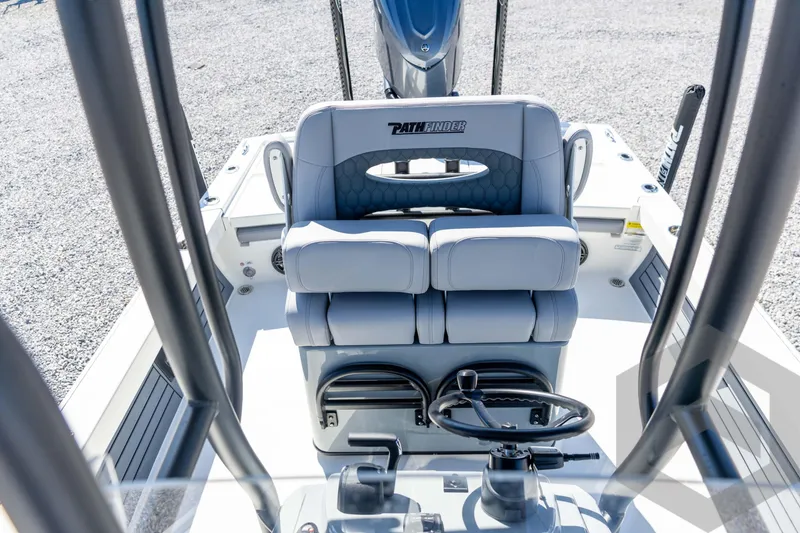 Slide: The Image of 2026 Pathfinder 2500 Hybrid boat interior with dual seats and steering wheel. - 80