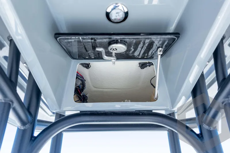 Slide: The Image of 2026 Pathfinder 2500 Hybrid boat interior, showcasing storage compartment and structural details. - 82