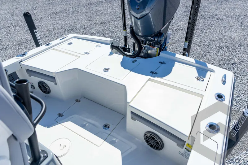 Slide: The Image of 2026 Pathfinder 2500 Hybrid boat deck with storage compartments and motor. - 85