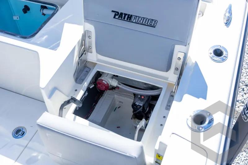Slide: The Image of 2026 Pathfinder 2500 Hybrid boat storage compartment with open hatch and visible wiring. - 90