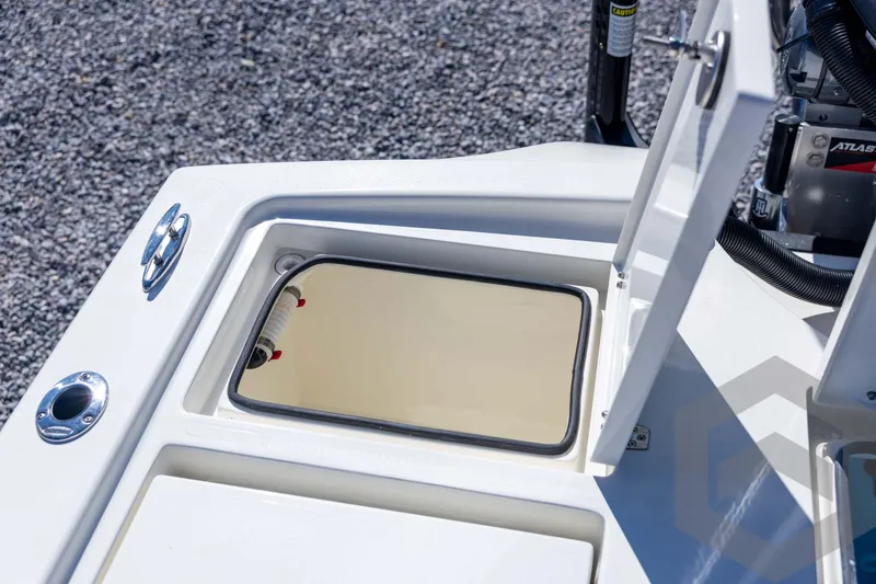 Slide: The Image of Open storage compartment on 2026 Pathfinder 2500 Hybrid boat deck. - 92