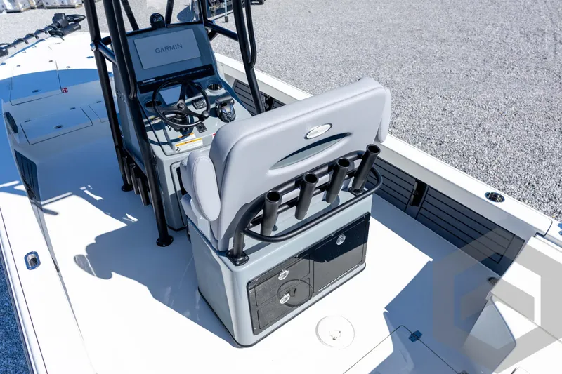 Slide: The Image of 2026 Pathfinder 2500 Hybrid boat interior with Garmin navigation and rod holders. - 95