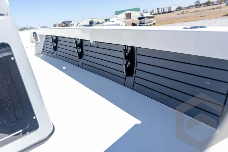 Slide: The Image of 2026 Pathfinder 2500 Hybrid boat deck with sleek storage compartments. - 97