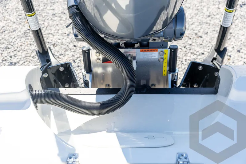 Slide: The Image of 2026 Pathfinder 2500 Hybrid boat engine detail with warning labels and hydraulic components. - 99