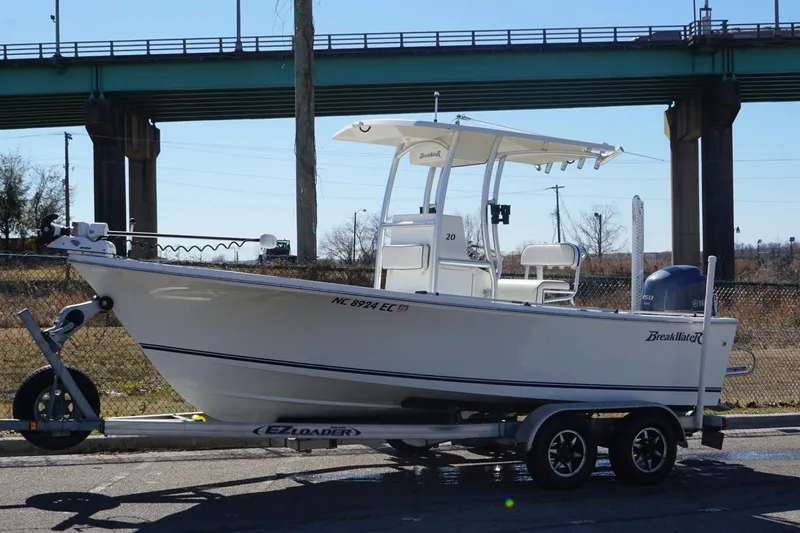 Slide: The Image of 2015 KenCraft BreakWater 20 boat on trailer, parked near a bridge. - 10