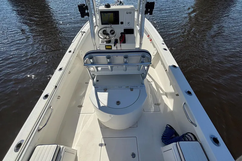 Slide: The Image of 2015 KenCraft BreakWater 20 boat interior with steering console and seating, on calm water. - 11