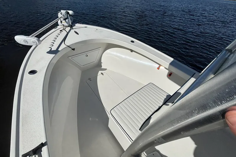 Slide: The Image of 2015 KenCraft BreakWater 20 boat interior with seating, on calm water. - 12