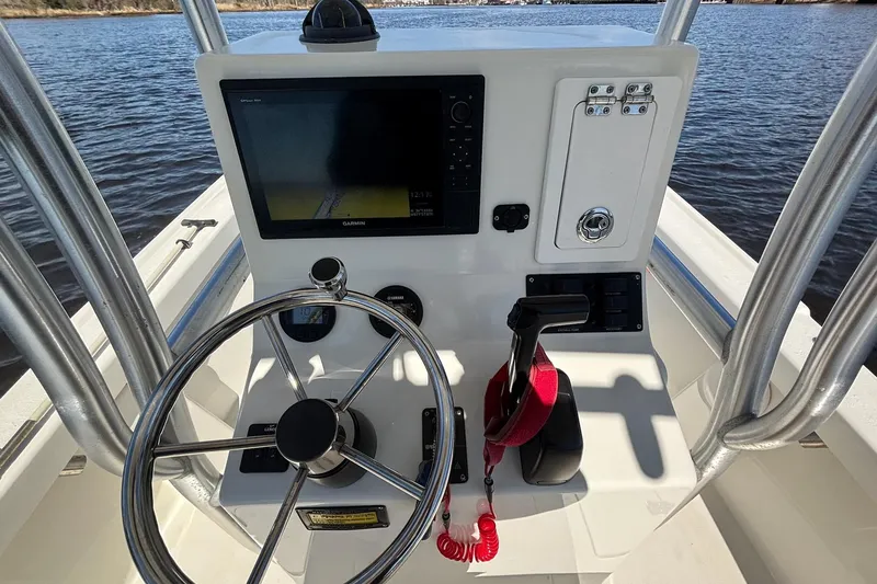 Slide: The Image of 2015 KenCraft BreakWater 20 boat console with steering wheel and navigation system. - 14