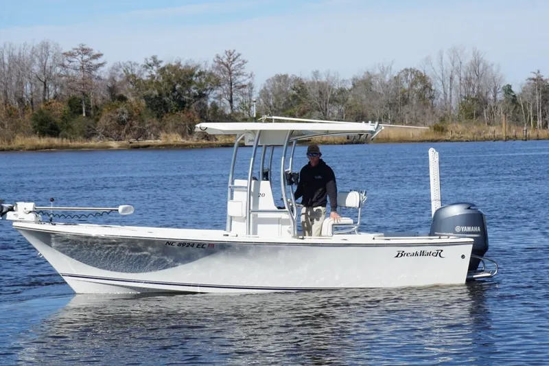 Slide: The Image of 2015 KenCraft BreakWater 20 boat on a calm river with Yamaha engine. - 5