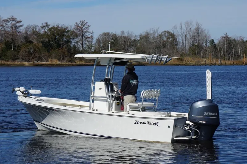 Slide: The Image of 2015 KenCraft BreakWater 20 boat on a calm river with Yamaha engine. - 6