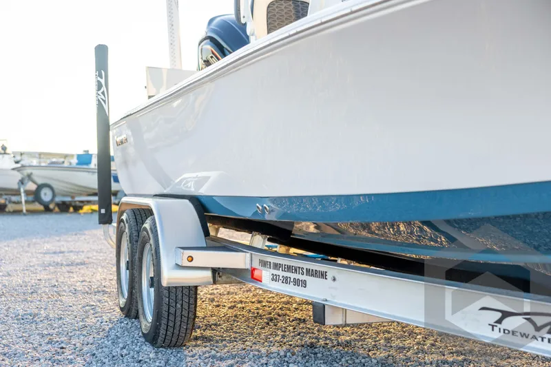 Slide: The Image of 2026 Tidewater 2110 Bay Max boat on trailer, parked on gravel lot. - 11