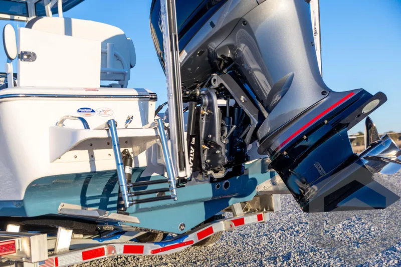 Slide: The Image of 2026 Tidewater 2110 Bay Max boat with powerful outboard motor on trailer. - 18