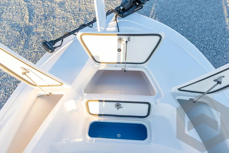 Slide: The Image of 2026 Tidewater 2110 Bay Max boat storage compartments and Garmin equipment. - 38