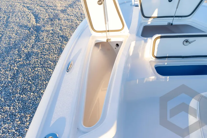 Slide: The Image of 2026 Tidewater 2110 Bay Max boat storage compartments open on deck. - 39