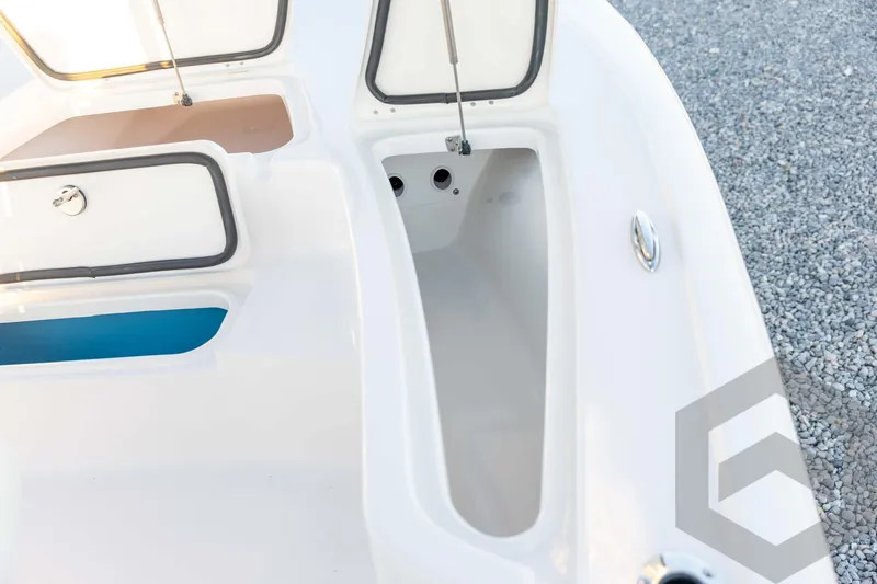 Slide: The Image of 2026 Tidewater 2110 Bay Max boat storage compartments on deck, open and empty. - 41