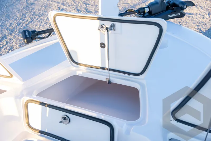 Slide: The Image of 2026 Tidewater 2110 Bay Max boat storage compartment with Garmin equipment. - 42