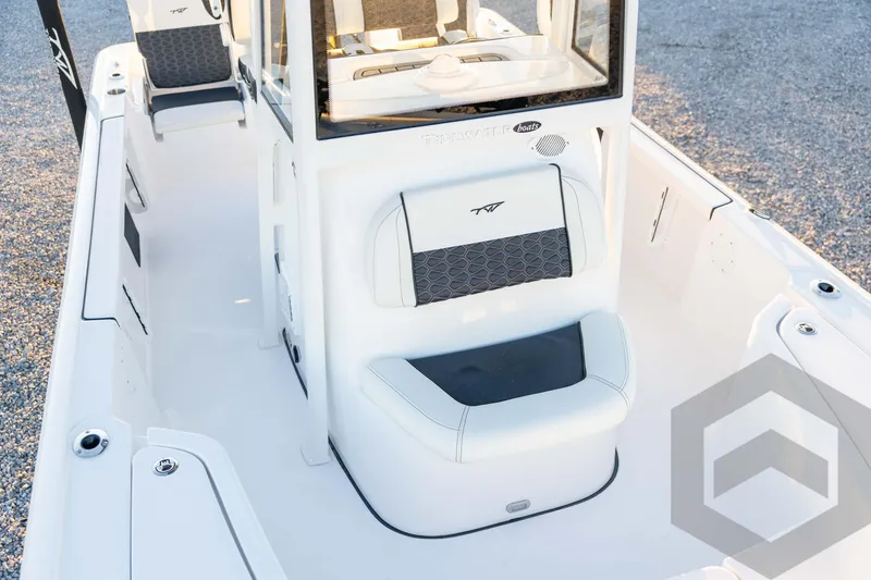 Slide: The Image of 2026 Tidewater 2110 Bay Max boat interior with seating and console, showcasing modern design. - 44