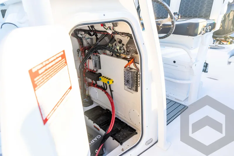 Slide: The Image of 2026 Tidewater 2110 Bay Max boat interior wiring and control panel. - 46