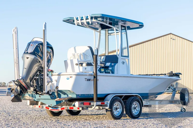 Slide: The Image of 2026 Tidewater 2110 Bay Max boat on trailer, featuring powerful outboard motor. - 5