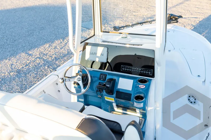 Slide: The Image of 2026 Tidewater 2110 Bay Max boat console with steering wheel and navigation equipment. - 50