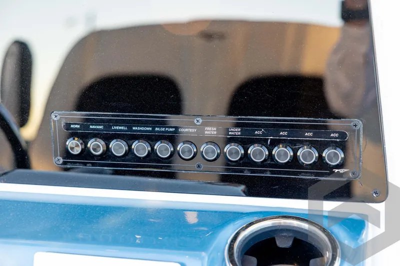 Slide: The Image of Control panel of 2026 Tidewater 2110 Bay Max boat with labeled switches. - 51