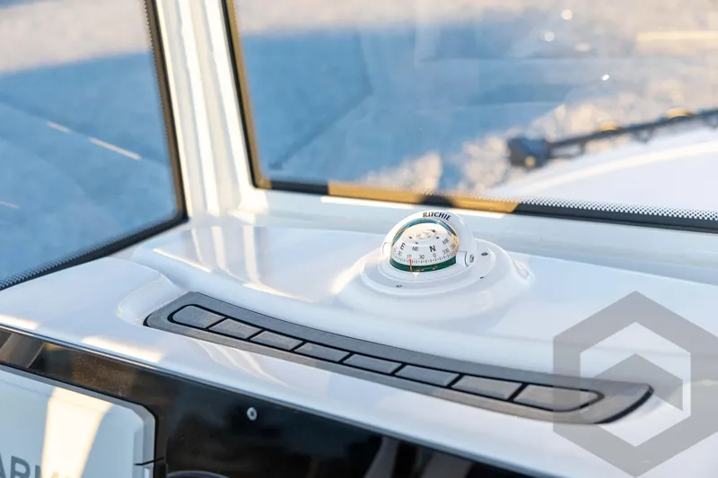 Slide: The Image of Compass on 2026 Tidewater 2110 Bay Max boat dashboard, close-up view. - 53
