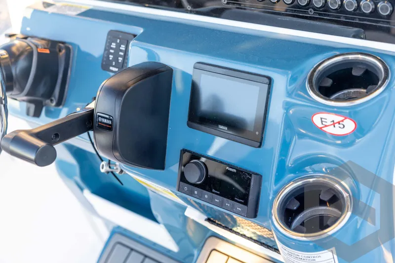 Slide: The Image of 2026 Tidewater 2110 Bay Max boat dashboard with Yamaha controls and Fusion audio system. - 54